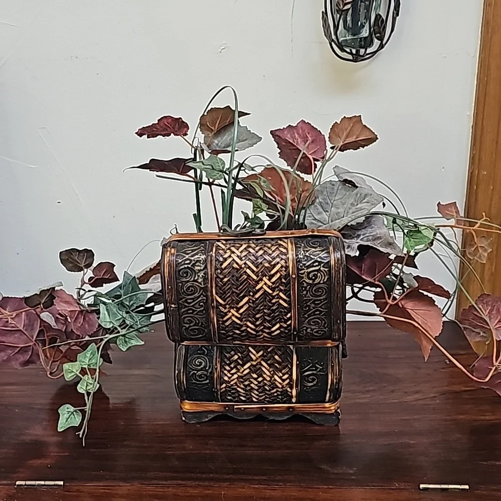 Vintage faux plant in wooden chest box decoration